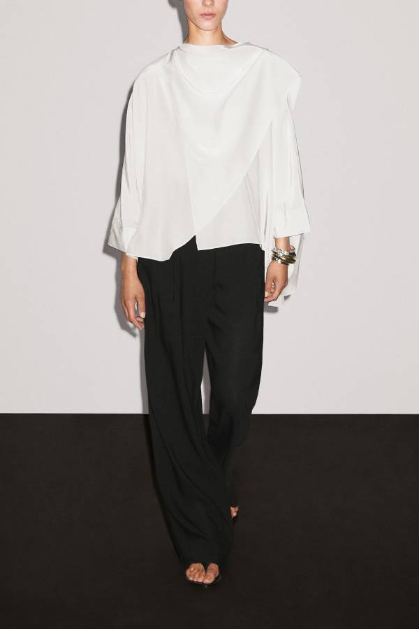 Short flowing cape with sleeve detail