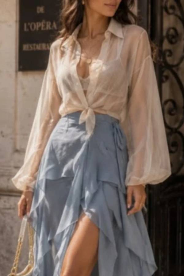 White sheer shirt paired with a blue layered skirt set